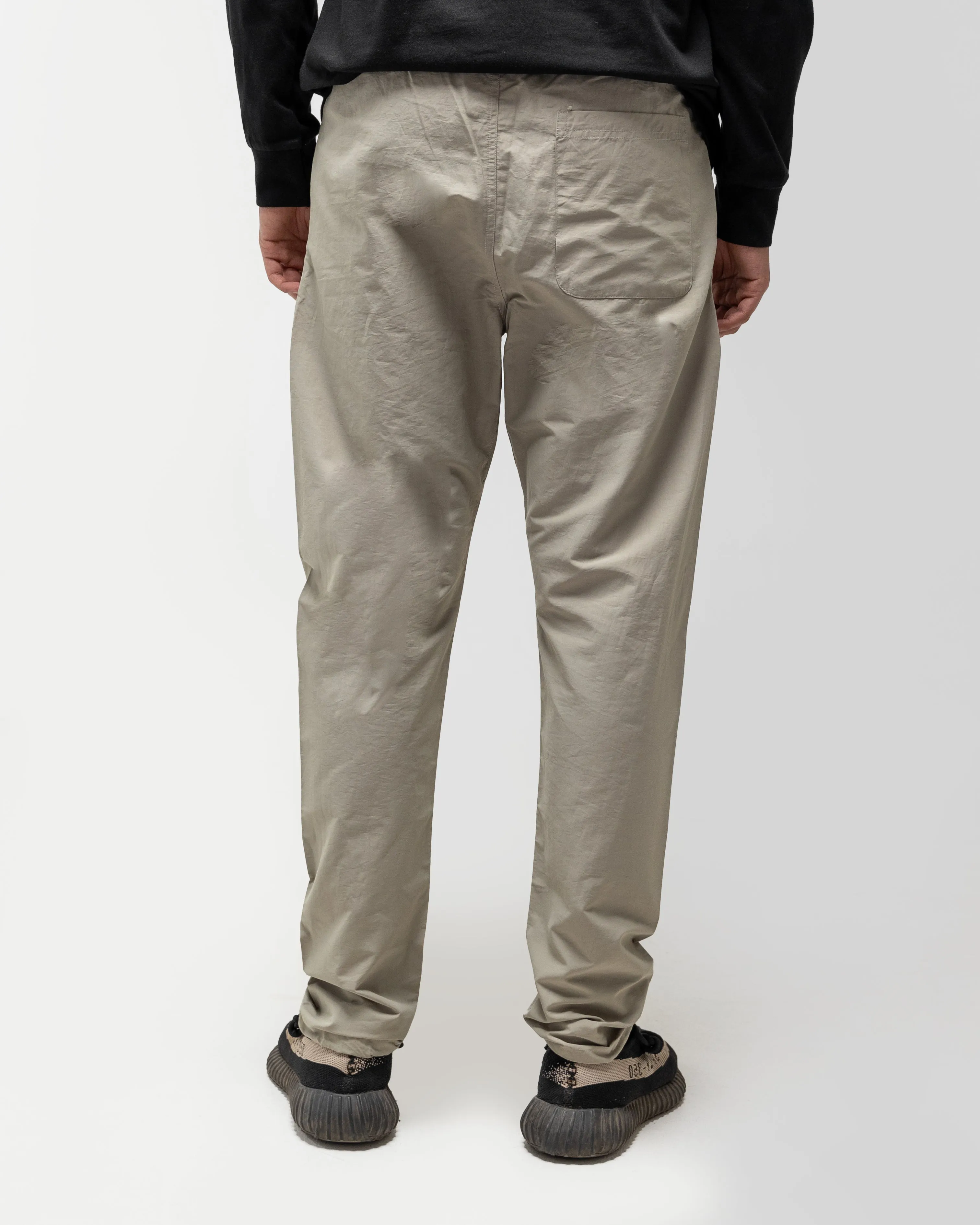 FEAR OF GOD ESSENTIALS TRACK PANT STONE